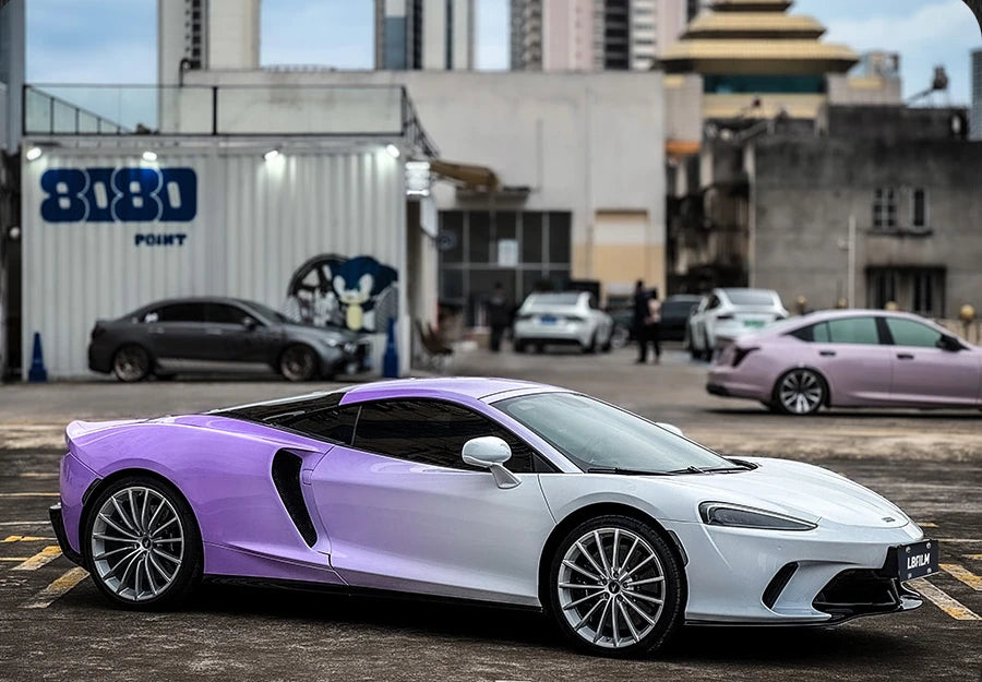 Purple and silver sports car showing a contrasting color-block wrap design